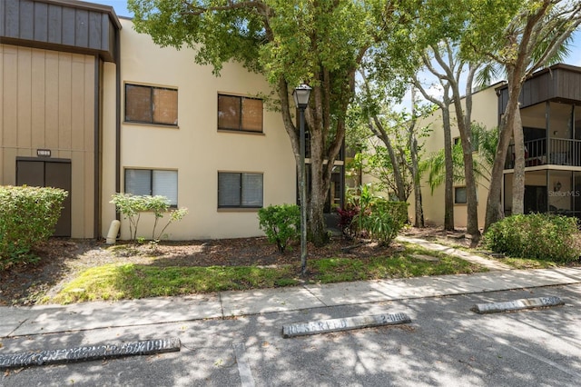 11809 Raintree Lake Ln Unit A, Tampa, FL 33617 - view of building exterior featuring uncovered parking