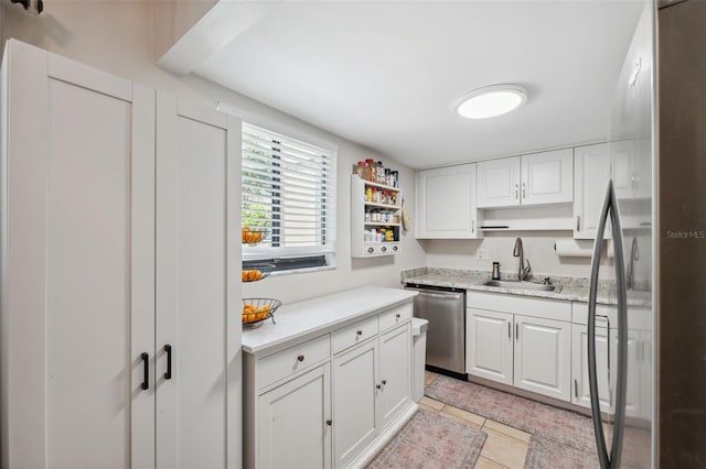 11809 Raintree Lake Ln Unit A, Tampa, FL 33617 - kitchen with stainless steel dishwasher, a sink, white cabinetry, light countertops, and open shelves