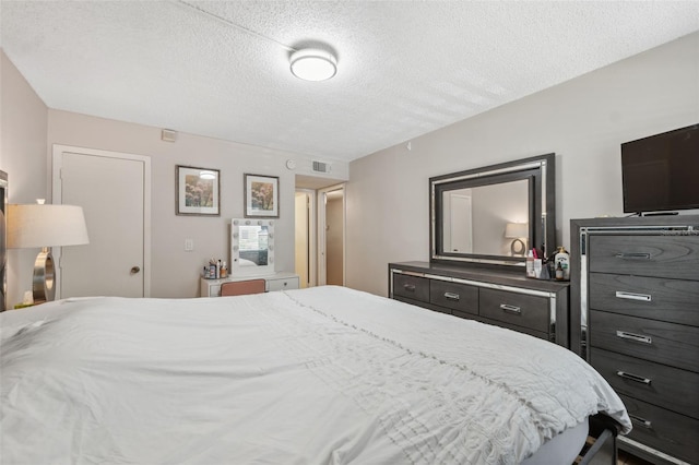 11809 Raintree Lake Ln Unit A, Tampa, FL 33617 - bedroom with a textured ceiling
