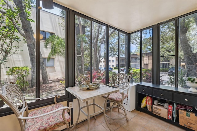 11809 Raintree Lake Ln Unit A, Tampa, FL 33617 - sunroom with tile patterned flooring