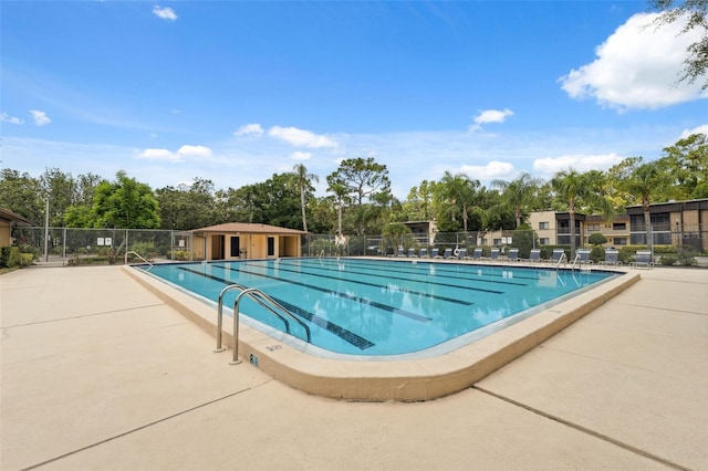 11809 Raintree Lake Ln Unit A, Tampa, FL 33617 - community pool with view of wooded area and a patio