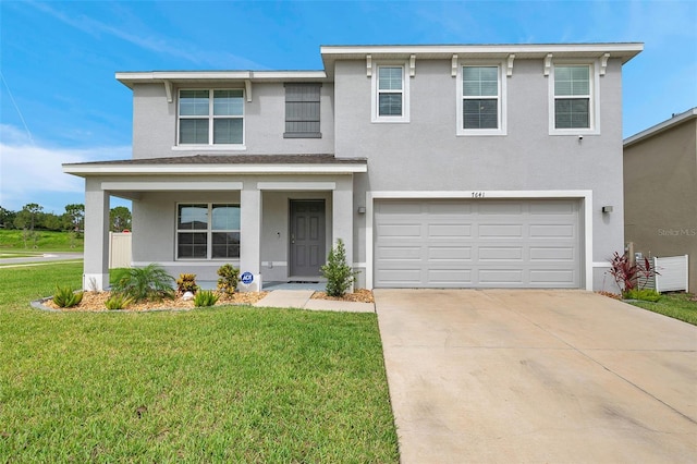 7641 Sail Clover Ln, Zephyrhills, FL 33540 - view of front facade featuring stucco siding, driveway, a garage, and a front lawn
