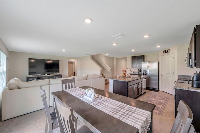 7641 Sail Clover Ln, Zephyrhills, FL 33540 - dining room with stairway and recessed lighting