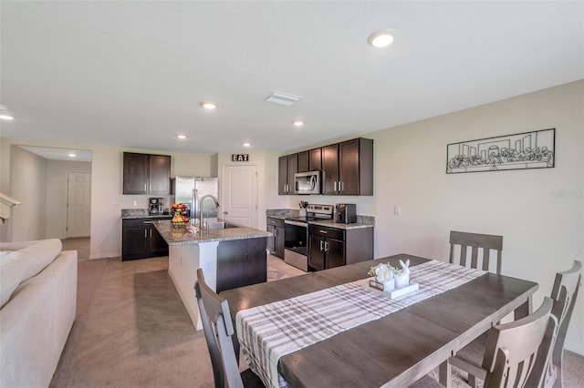 7641 Sail Clover Ln, Zephyrhills, FL 33540 - dining space featuring recessed lighting, light colored carpet, and baseboards
