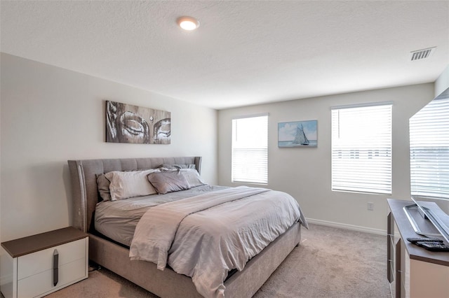 7641 Sail Clover Ln, Zephyrhills, FL 33540 - bedroom featuring light carpet and baseboards