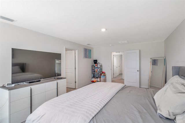 7641 Sail Clover Ln, Zephyrhills, FL 33540 - bedroom featuring baseboards, recessed lighting, and light colored carpet