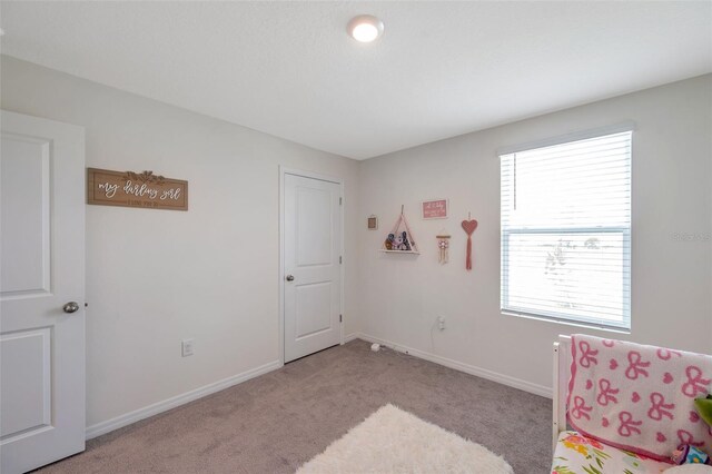 7641 Sail Clover Ln, Zephyrhills, FL 33540 - carpeted bedroom featuring baseboards