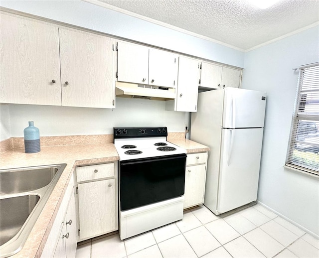 13926 Mission Oaks Blvd, Seminole, FL 33776 - kitchen with electric range, under cabinet range hood, freestanding refrigerator, light countertops, and a textured ceiling