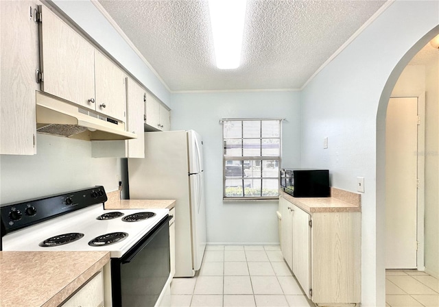 13926 Mission Oaks Blvd, Seminole, FL 33776 - kitchen with range with electric stovetop, under cabinet range hood, black microwave, arched walkways, and light countertops