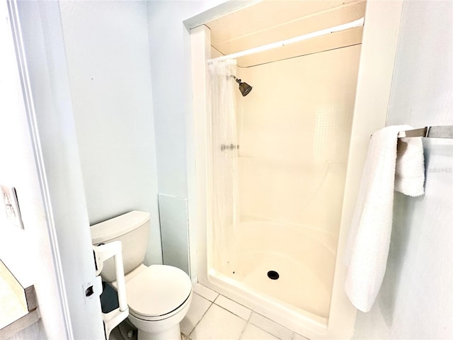 13926 Mission Oaks Blvd, Seminole, FL 33776 - full bathroom featuring toilet, a stall shower, and tile patterned floors