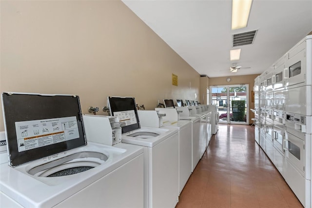13926 Mission Oaks Blvd, Seminole, FL 33776 - communal laundry room with stacked washer / drying machine and washing machine and clothes dryer