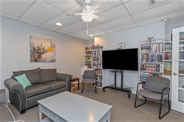 13926 Mission Oaks Blvd, Seminole, FL 33776 - living room featuring carpet, ceiling fan, a paneled ceiling, and recessed lighting
