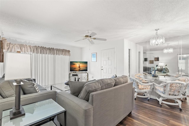 2699 Pine Ridge Way E Unit H2, Palm Harbor, FL 34684 - living area with a textured ceiling, a ceiling fan, wood finished floors, and a chandelier