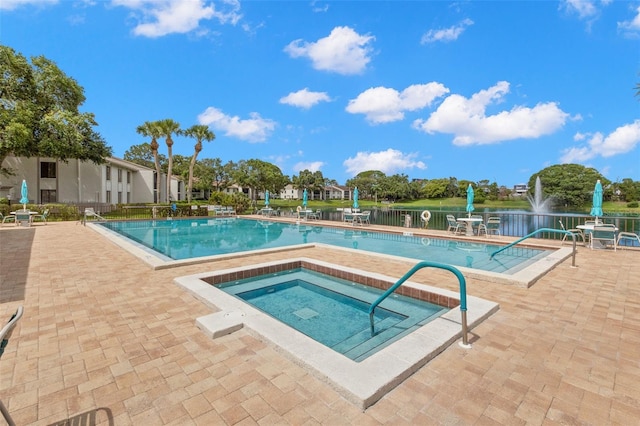 2699 Pine Ridge Way E Unit H2, Palm Harbor, FL 34684 - community pool featuring a patio and a community hot tub