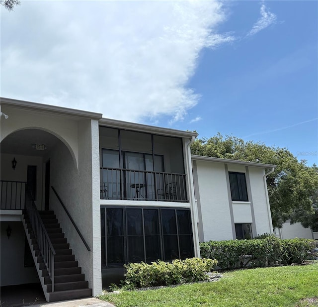 2699 Pine Ridge Way E Unit H2, Palm Harbor, FL 34684 - view of building exterior featuring stairs