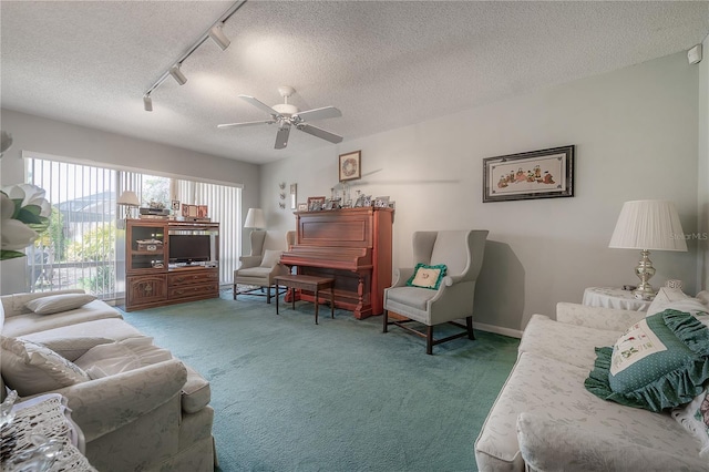 7902 Heather Ct, Tampa, FL 33634 - living room featuring carpet flooring, track lighting, a textured ceiling, and ceiling fan