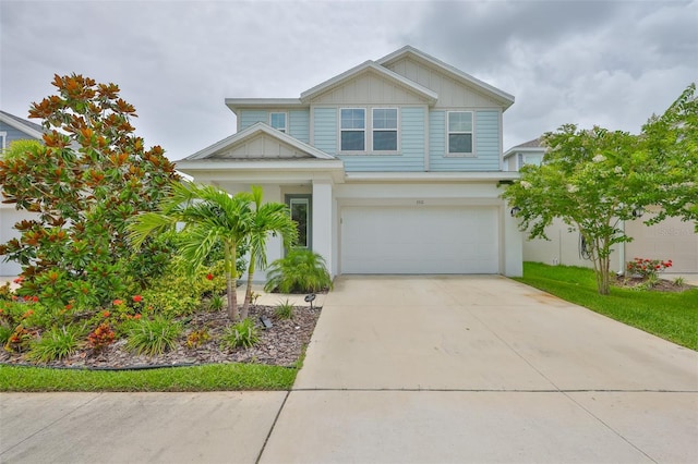 5511 Del Coronado Dr, Apollo Beach, FL 33572 - view of front of home featuring board and batten siding, a garage, and driveway
