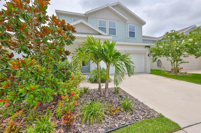 5511 Del Coronado Dr, Apollo Beach, FL 33572 - view of front of property featuring a garage, concrete driveway, and board and batten siding