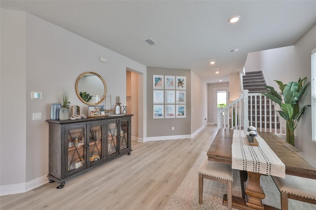 5511 Del Coronado Dr, Apollo Beach, FL 33572 - dining area featuring light wood finished floors, baseboards, recessed lighting, and stairway