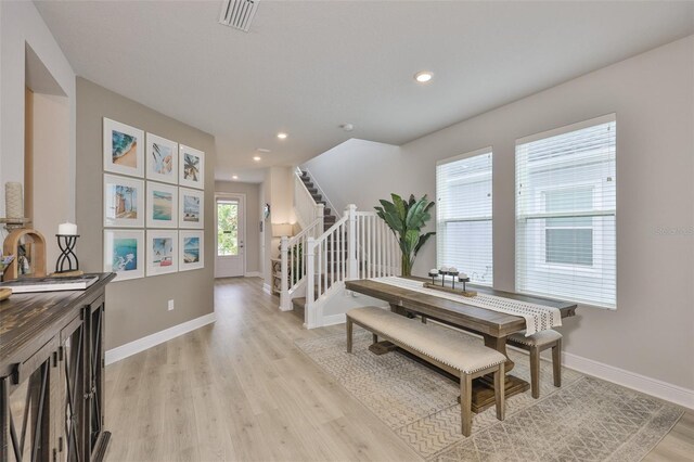 5511 Del Coronado Dr, Apollo Beach, FL 33572 - dining area featuring light wood-style floors, recessed lighting, baseboards, and stairs