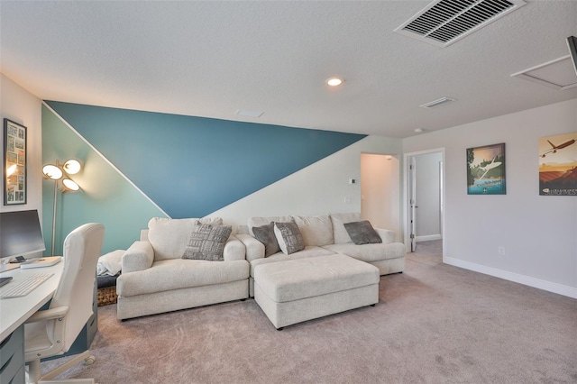 5511 Del Coronado Dr, Apollo Beach, FL 33572 - carpeted living room with baseboards, a textured ceiling, recessed lighting, and attic access