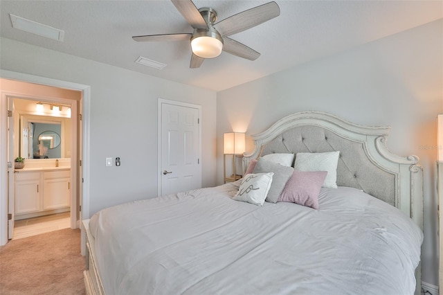 5511 Del Coronado Dr, Apollo Beach, FL 33572 - bedroom with light colored carpet, a ceiling fan, ensuite bath, and a sink