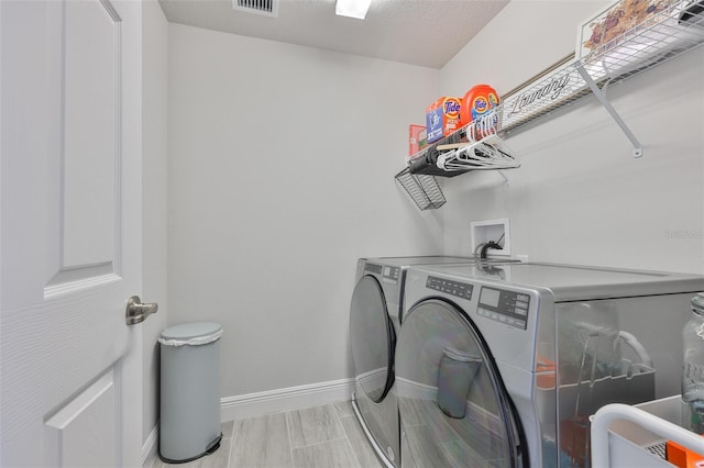 5511 Del Coronado Dr, Apollo Beach, FL 33572 - washroom featuring washing machine and clothes dryer and baseboards