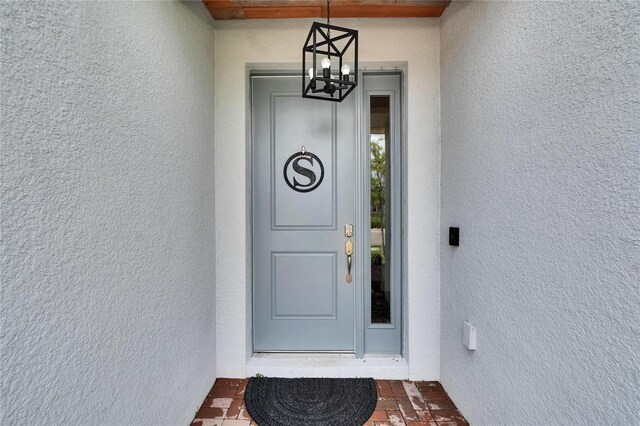 11785 Little River Way, Parrish, FL 34219 - view of exterior entry featuring stucco siding