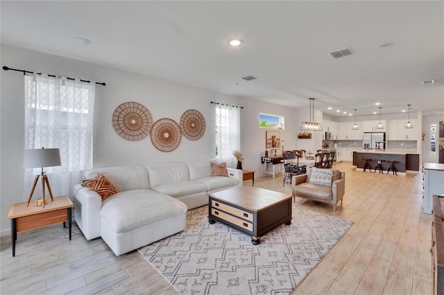 11785 Little River Way, Parrish, FL 34219 - living area featuring recessed lighting and light wood-style flooring