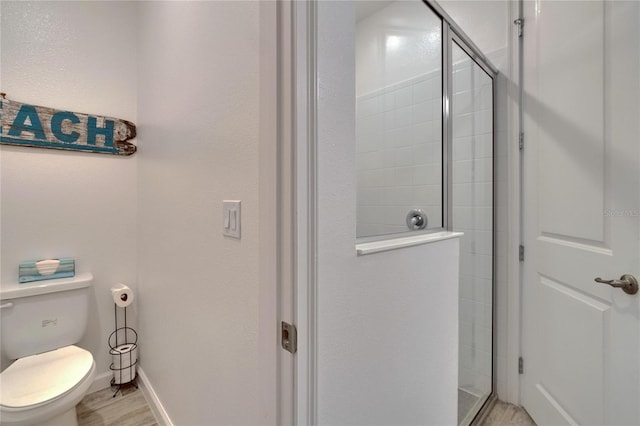 11785 Little River Way, Parrish, FL 34219 - full bath featuring a stall shower, toilet, wood finished floors, and baseboards