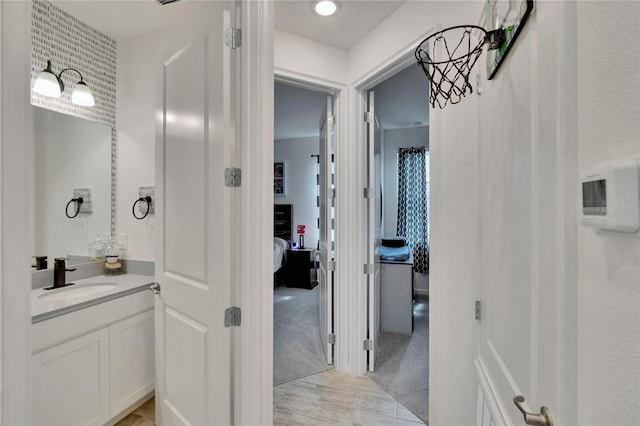 11785 Little River Way, Parrish, FL 34219 - bathroom featuring vanity, ensuite bath, and wood finished floors