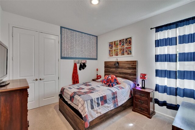 11785 Little River Way, Parrish, FL 34219 - bedroom with light carpet and a closet