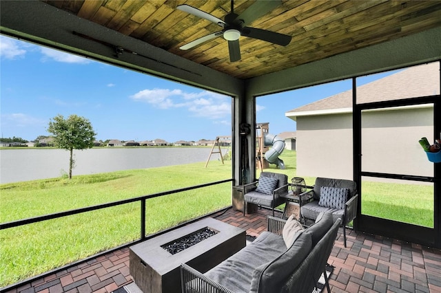 11785 Little River Way, Parrish, FL 34219 - sunroom featuring a water view, ceiling fan, and an outdoor living space with a fire pit