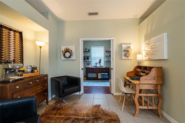 14320 Tree Swallow Way, Lakewood Ranch, FL 34202 - living area with light tile patterned floors and baseboards