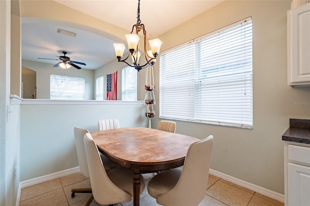14320 Tree Swallow Way, Lakewood Ranch, FL 34202 - dining room with baseboards, a ceiling fan, light tile patterned flooring, and a chandelier