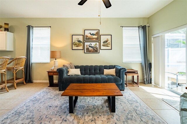 14320 Tree Swallow Way, Lakewood Ranch, FL 34202 - living room with light tile patterned floors, ceiling fan, and baseboards