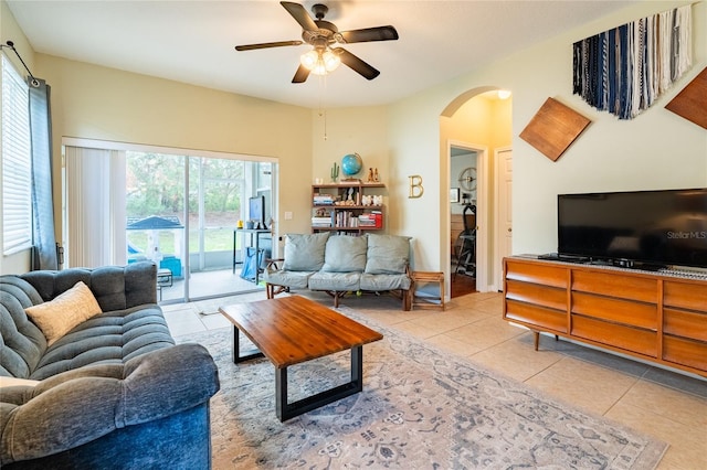 14320 Tree Swallow Way, Lakewood Ranch, FL 34202 - living room with light tile patterned floors, ceiling fan, and arched walkways