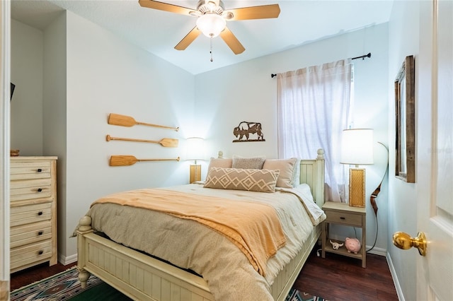 14320 Tree Swallow Way, Lakewood Ranch, FL 34202 - bedroom with dark wood-type flooring, baseboards, and ceiling fan