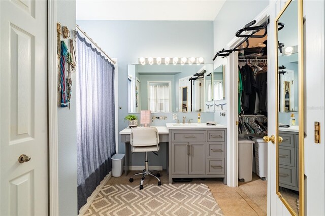 14320 Tree Swallow Way, Lakewood Ranch, FL 34202 - bathroom with vanity, tile patterned flooring, and a walk in closet