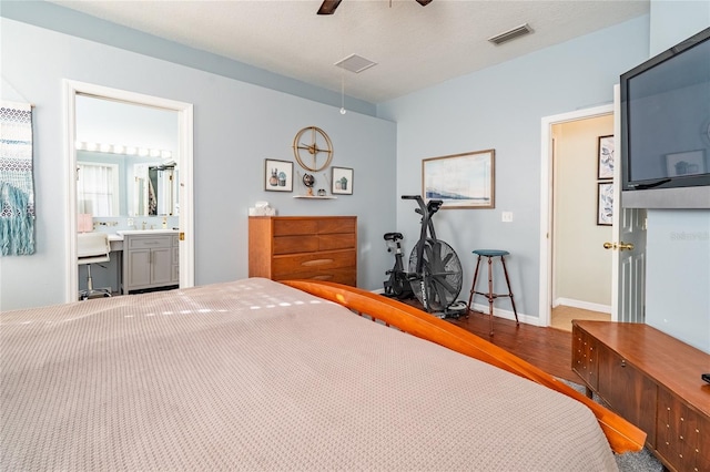 14320 Tree Swallow Way, Lakewood Ranch, FL 34202 - bedroom featuring wood finished floors, a desk, baseboards, a ceiling fan, and a sink