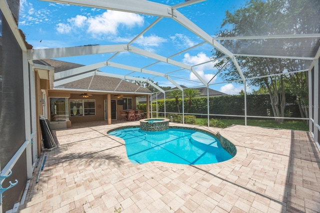 5519 Reflections Blvd, Lutz, FL 33558 - view of swimming pool featuring ceiling fan, a patio area, glass enclosure, and a pool with connected hot tub
