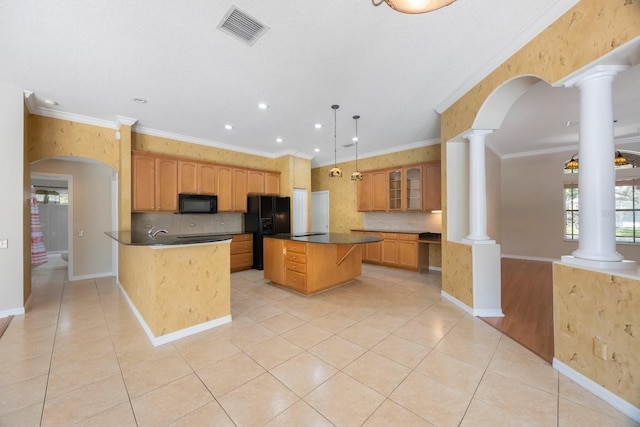 5519 Reflections Blvd, Lutz, FL 33558 - kitchen featuring black appliances, decorative columns, dark countertops, decorative backsplash, and recessed lighting