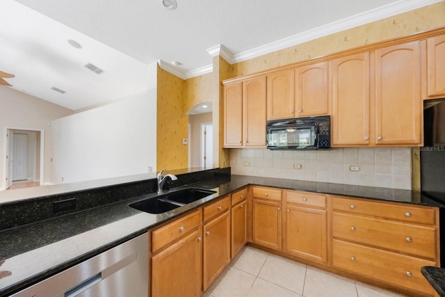 5519 Reflections Blvd, Lutz, FL 33558 - kitchen with black appliances, a sink, dark stone countertops, tasteful backsplash, and crown molding