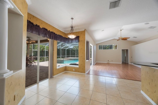 5519 Reflections Blvd, Lutz, FL 33558 - spare room with a ceiling fan, tile patterned floors, vaulted ceiling, and baseboards