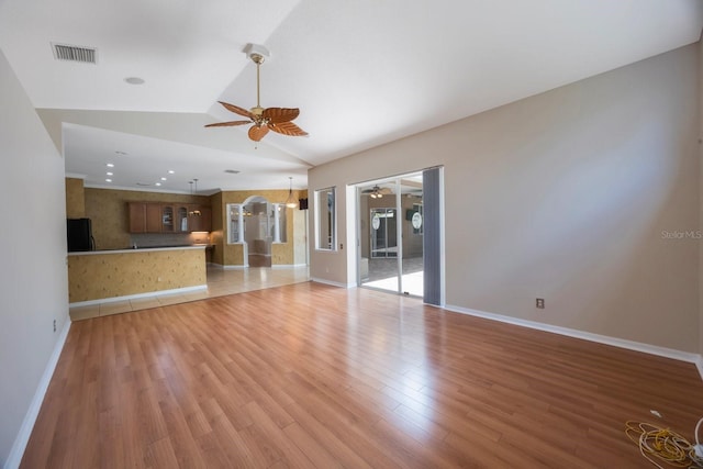 5519 Reflections Blvd, Lutz, FL 33558 - unfurnished living room featuring a ceiling fan, lofted ceiling, light wood-type flooring, baseboards, and recessed lighting
