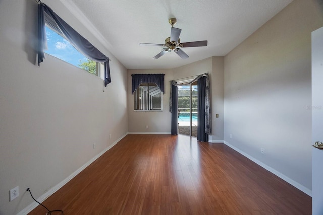 5519 Reflections Blvd, Lutz, FL 33558 - empty room with a ceiling fan, wood finished floors, and baseboards