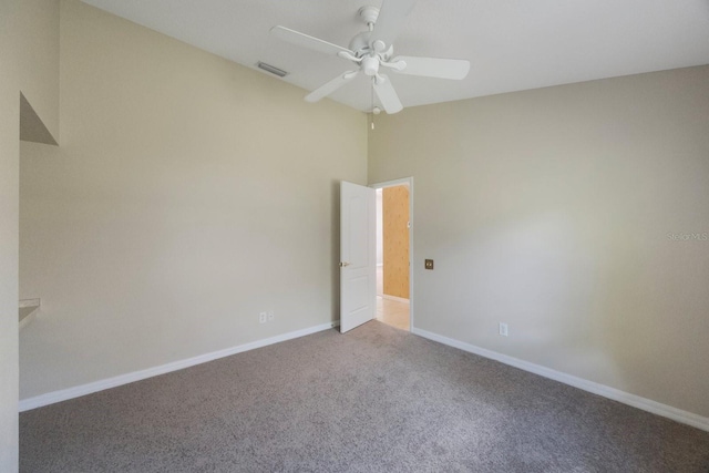 5519 Reflections Blvd, Lutz, FL 33558 - empty room featuring ceiling fan, carpet flooring, baseboards, and vaulted ceiling