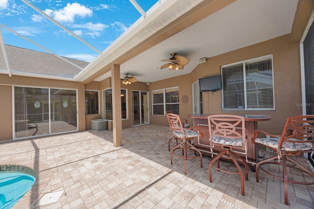 5519 Reflections Blvd, Lutz, FL 33558 - view of patio / terrace featuring ceiling fan, glass enclosure, and an outdoor pool