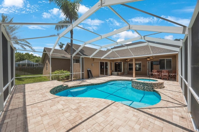5519 Reflections Blvd, Lutz, FL 33558 - view of swimming pool featuring ceiling fan, a patio area, a lanai, and a pool with connected hot tub