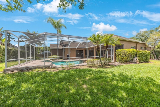 5519 Reflections Blvd, Lutz, FL 33558 - rear view of property with a lawn, an outdoor pool, a lanai, and stucco siding